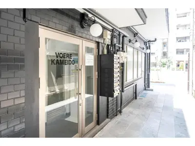 a store window with a sign on the side of a building at VOERE KAMEIDO - Vacation STAY 48878v in Tokyo