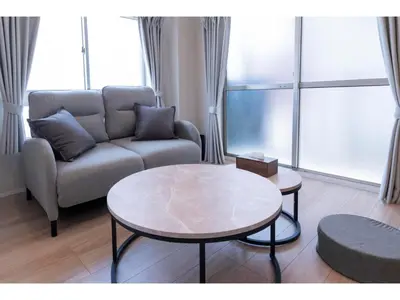 a living room with a couch and a table at VOERE KAMEIDO - Vacation STAY 48867v in Tokyo