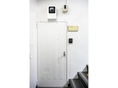 a white elevator with a phone on the wall at VOERE KAMEIDO - Vacation STAY 48867v in Tokyo