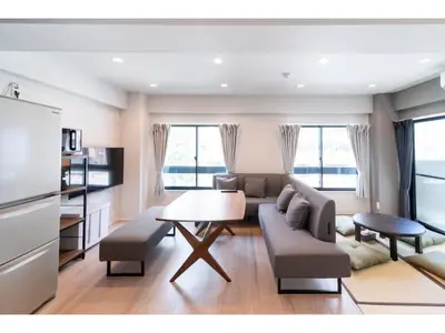 a living room with a table and a couch at VOERE KAMEIDO - Vacation STAY 48034v in Tokyo