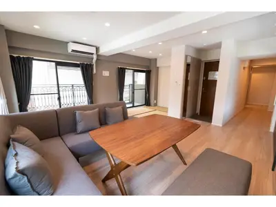 a living room with a couch and a wooden table at VOERE KAMEIDO - Vacation STAY 48034v in Tokyo