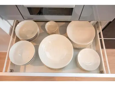 a group of white plates in a drawer at VOERE KAMEIDO - Vacation STAY 48034v in Tokyo