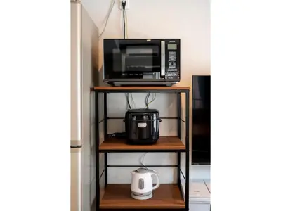 a microwave and a coffee maker on a shelf at VOERE KAMEIDO - Vacation STAY 48034v in Tokyo