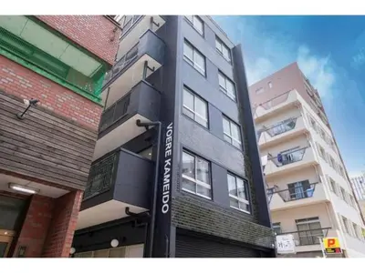 a building with a sign on the side of it at VOERE KAMEIDO - Vacation STAY 48034v in Tokyo