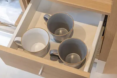 three cups on a shelf in a cabinet at Wooden warmth of a house 8 people Skytree 7 minutes 75 square meters Asakusa, Shibuya, Narita, Haneda direct in Tokyo