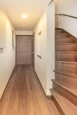 a hallway with wooden floors and a stair case at Wooden warmth of a house 8 people Skytree 7 minutes 75 square meters Asakusa, Shibuya, Narita, Haneda direct in Tokyo