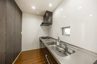 a kitchen with a sink and a stove at 9-min walk to Ikebukuro Station, 1-min walk to Kanamecho Station Max 8 guests 70 sqm Free parking Direct access to Shinjuku, Shibuya, Ueno in Tokyo