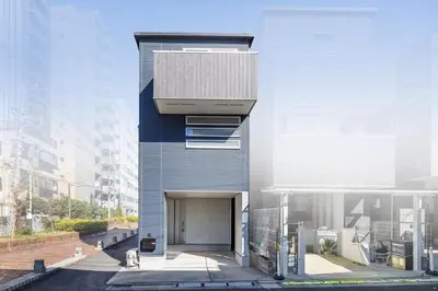 a facade of a building with a garage at 9-min walk to Ikebukuro Station, 1-min walk to Kanamecho Station Max 8 guests 70 sqm Free parking Direct access to Shinjuku, Shibuya, Ueno in Tokyo