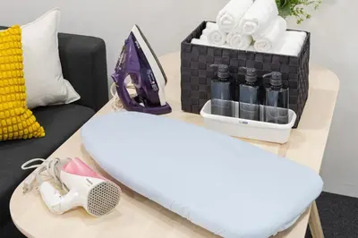 a table with a surfboard and a box of towels at AT Akihabara No3 in Tokyo