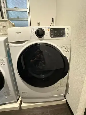 a microwave with a picture of a person on it at Rest Collection SEIWA LODGE Tokyo in Tokyo