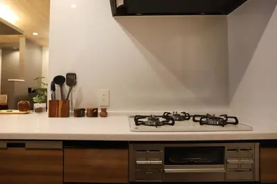 a kitchen with a stove top oven in a kitchen at New Shibuya Area House 6 pax with Skyline View in Tokyo