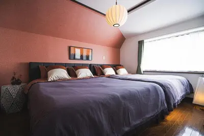 a bedroom with a large bed with a large window at Shibuya Area, 5-min to Shinjuku, 7-min to Sta, 4BR in Tokyo