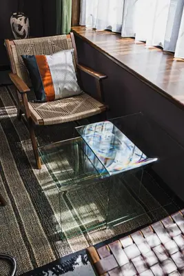 a glass coffee table in front of a chair and a chair at Shibuya Area, 5-min to Shinjuku, 7-min to Sta, 4BR in Tokyo