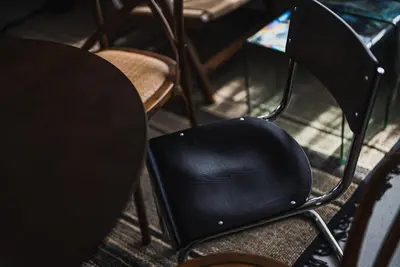 a black chair sitting next to a table at Shibuya Area, 5-min to Shinjuku, 7-min to Sta, 4BR in Tokyo