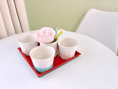 a tray with four cups and flowers on a table at 401, 6 min walk to subway stn, Tokyo Univ, Tokyo Tower, Tokyo-Dome direct by subway in Tokyo
