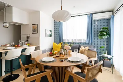 a kitchen and dining room with a table and chairs at ARiA STAY SHINAGAWA in Tokyo
