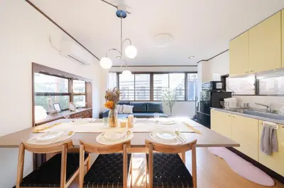 a kitchen with a table and chairs in a room at Tokyo Skytree view Oshiage Sta 3 min by car 6bed in Tokyo