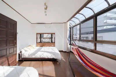 a bedroom with a bed and a large window at Tokyo Skytree view Oshiage Sta 3 min by car 6bed in Tokyo