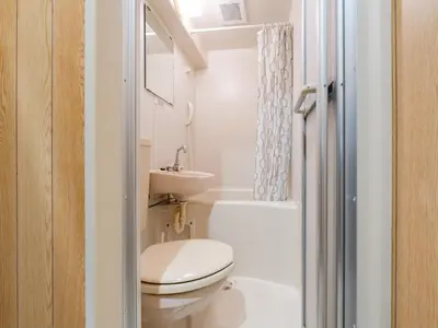 a small bathroom with a toilet and a sink at Ikebukuro-Otsuka-10min ShinOtsuka Sta-For families and groups-Switch-net-Mobile Wi-Fi in Tokyo