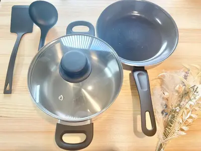 a strainer and a frying pan on a table at Hotel Kototoi Juku HAKU in Tokyo