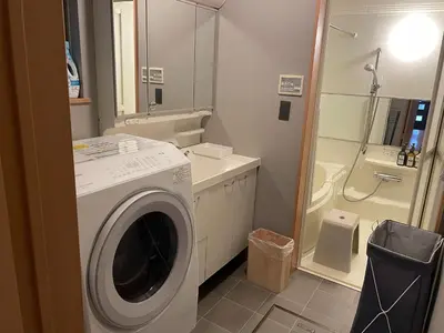 a bathroom with a washing machine and a toilet at Rakuna Inn Nizi - Oshiage 2 - Vacation STAY 46832v in Tokyo