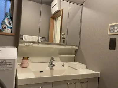 a bathroom with a sink and a mirror at Rakuna Inn Nizi - Oshiage 2 - Vacation STAY 46832v in Tokyo