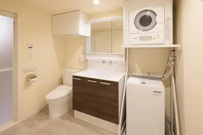 a small bathroom with a toilet and a microwave at Cityzen Tokyo in Tokyo