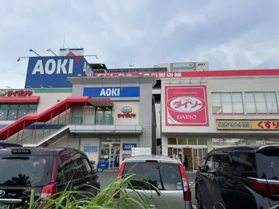 a parking lot with cars parked in front of a building at \u30e2\u30ea\u30a2\u30d1\u30fc\u30c8\u30e1\u30f3\u30c8 203 in Tokyo