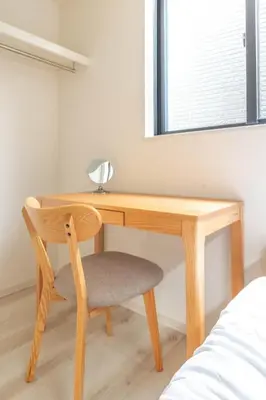 a wooden desk with a chair next to a window at Bear Bear House 1-Min Walk to the Station in Tokyo