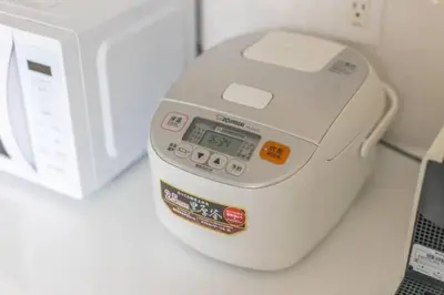 a scale sitting on a counter next to a microwave at Bear Bear House 1-Min Walk to the Station in Tokyo