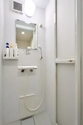 a bathroom with a shower and a mirror at Tokyo Base \u6674\u7a7a\u6a39 2BR Loft Stylish House Asakusa SkyTree Area in Tokyo