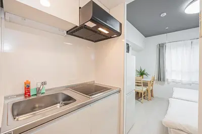 a kitchen with a sink and a counter top at Japan House Komagome Apartment\u65b0\u7bc9\u99d2\u8fbc\u99c5\u5f92\u6b695\u5206 in Tokyo