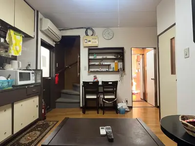a kitchen with a table and a dining room at Tokyo cozy house-Direct to ginza shibuya shinjuku in Tokyo