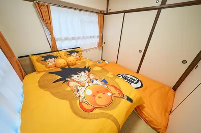 a bedroom with two beds in a room at Kan'eiji-zaka Heim 寛永寺坂ハイム in Tokyo