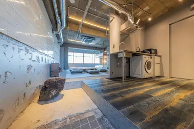 a room with a washing machine in a building at \u30b7\u30ce\u30f3\u8535\u524d CINON Kuramae in Tokyo