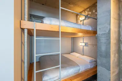 a bedroom with bunk beds in a room at \u30b7\u30ce\u30f3\u8535\u524d CINON Kuramae in Tokyo