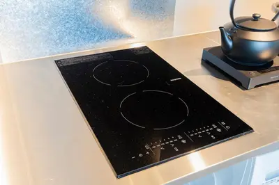 a stove top with a pot on top of a counter at \u30b7\u30ce\u30f3\u8535\u524d CINON Kuramae in Tokyo