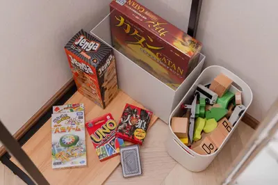 a childs toy container with toys and books on a table at Aimer202 AI22 in Tokyo