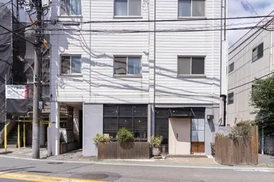 a white building on the side of a street at Aimer202 AI22 in Tokyo