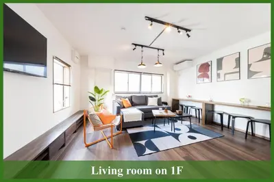 a living room with a couch and a living room on it at Tokyo Stay Aoto in Tokyo