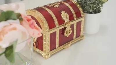a red and gold box on a table with flowers at TDR\u8eca9\u5206 3BR 5Bed \u5922\u306e\u7d9a\u304d\u3092\u697d\u3057\u3081\u308b\u5bbf -TAMU-LAND Kasai- in Tokyo