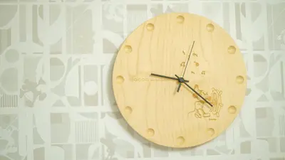 a wooden clock is hanging on a wall at TDR\u8eca9\u5206 3BR 5Bed \u5922\u306e\u7d9a\u304d\u3092\u697d\u3057\u3081\u308b\u5bbf -TAMU-LAND Kasai- in Tokyo