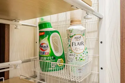 a closet with two bottles of cleaning products in it at Koiwa Station Entire Villa Two Generation House with 1BR Cozy Apartment and 4BR Spacious Home Easy JR Access to Asakusa Skytree Shinjuku Shibuya Ueno and Narita Haneda Airport in Tokyo