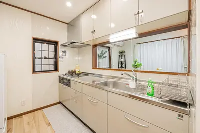 a kitchen with a sink and a counter top at Koiwa Station Entire Villa Two Generation House with 1BR Cozy Apartment and 4BR Spacious Home Easy JR Access to Asakusa Skytree Shinjuku Shibuya Ueno and Narita Haneda Airport in Tokyo