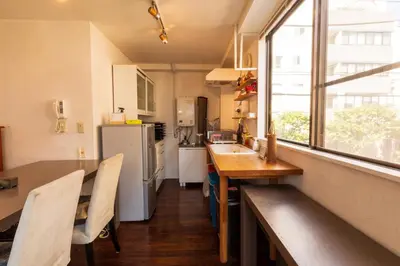 a kitchen with a counter and a sink and a window at Minimalism HOTEL Asakusa in Tokyo