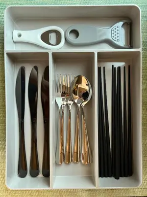 a plastic container filled with utensils and scissors at nestay suite tokyo Takadanobaba in Tokyo