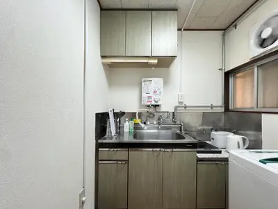 a kitchen with a sink and a counter top at nestay suite tokyo Takadanobaba in Tokyo