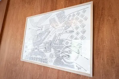 a framed drawing of a plant on a table at NEIJU Apartment Hotel - Live Like a Local in Nakano - Direct Shinjuku Access in Tokyo
