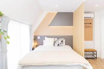 a bedroom with a large bed and a large window at \u5c0f\u718aAnnex 129Tb in Tokyo