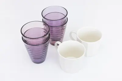 four empty purple and white glasses and a white mug at \u5c0f\u718aAnnex 129Tb in Tokyo